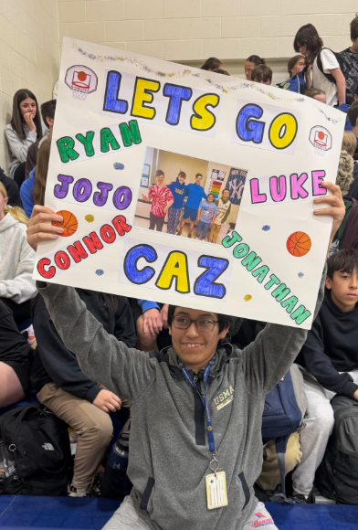 student holding sign - Let's Go Caz