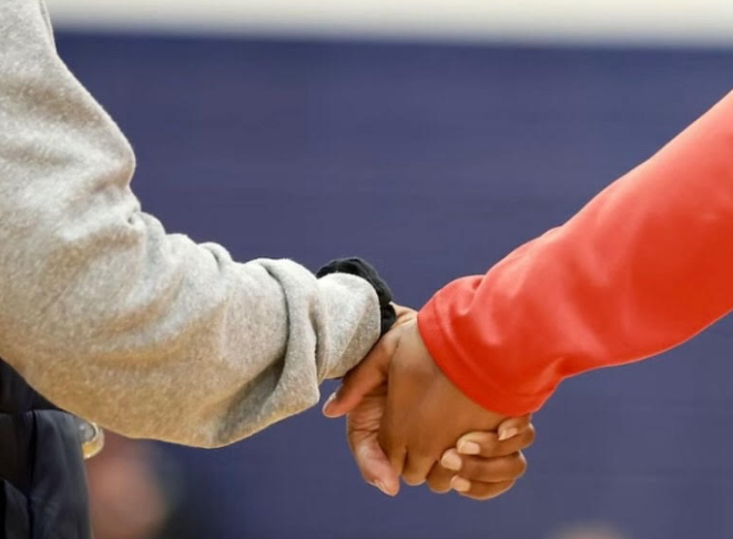 students holding hands